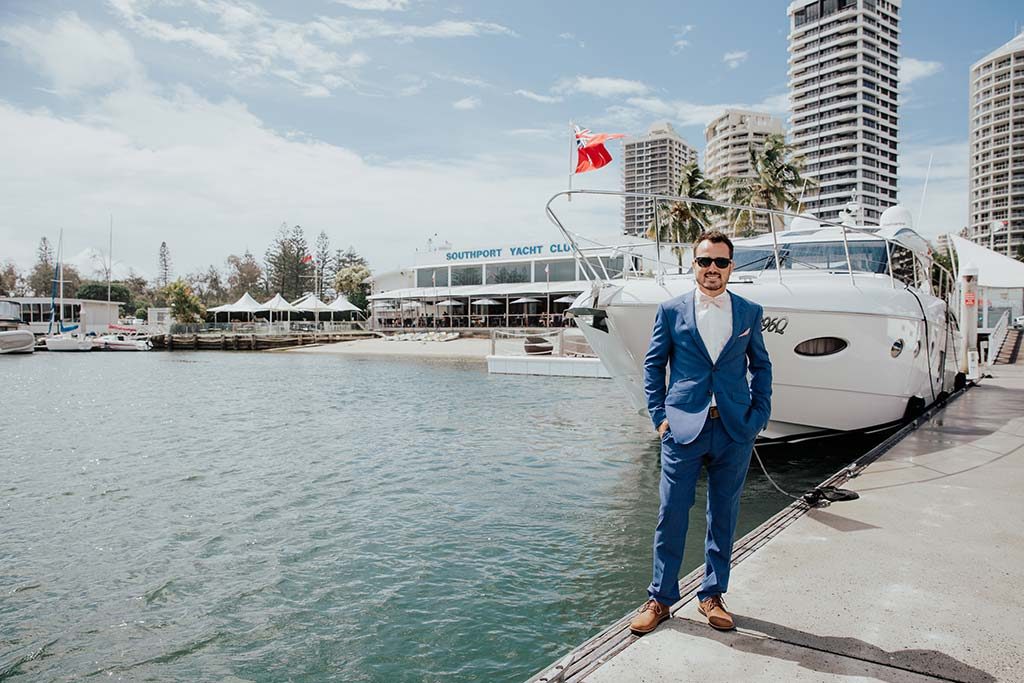 groom on boat before wedding