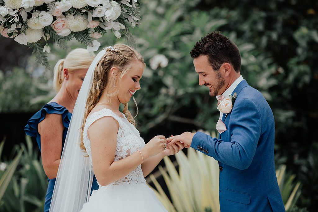 bride and groom exchange rings