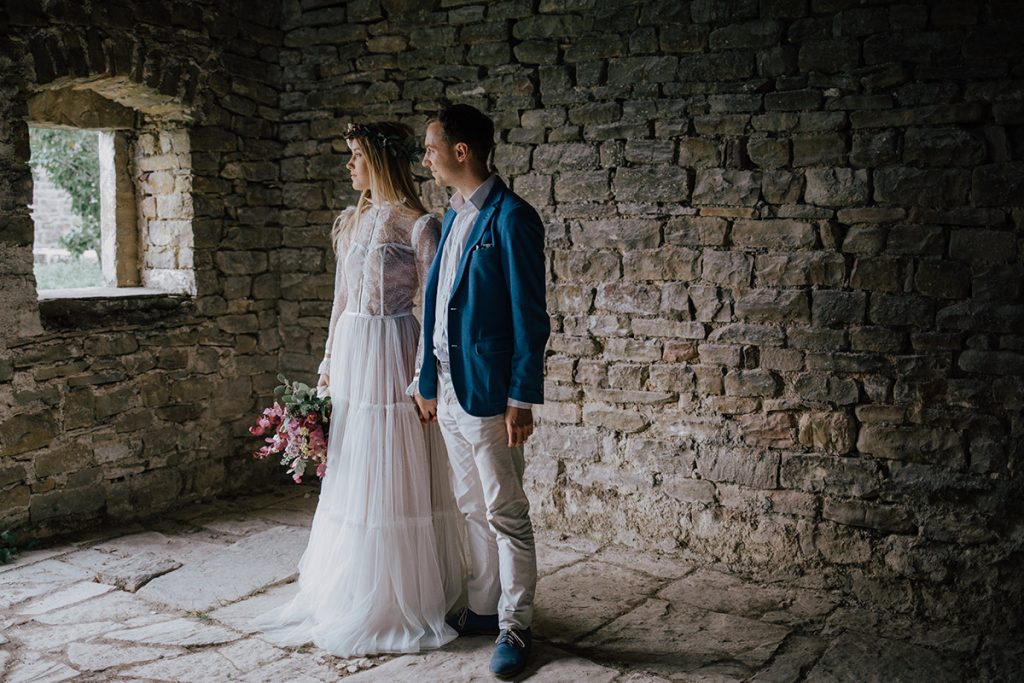 bride and groom in stone castle