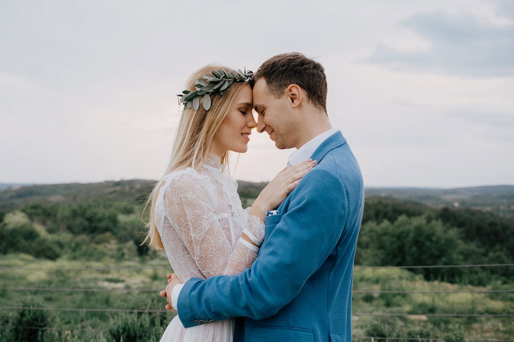 photography of bride and groom embracing