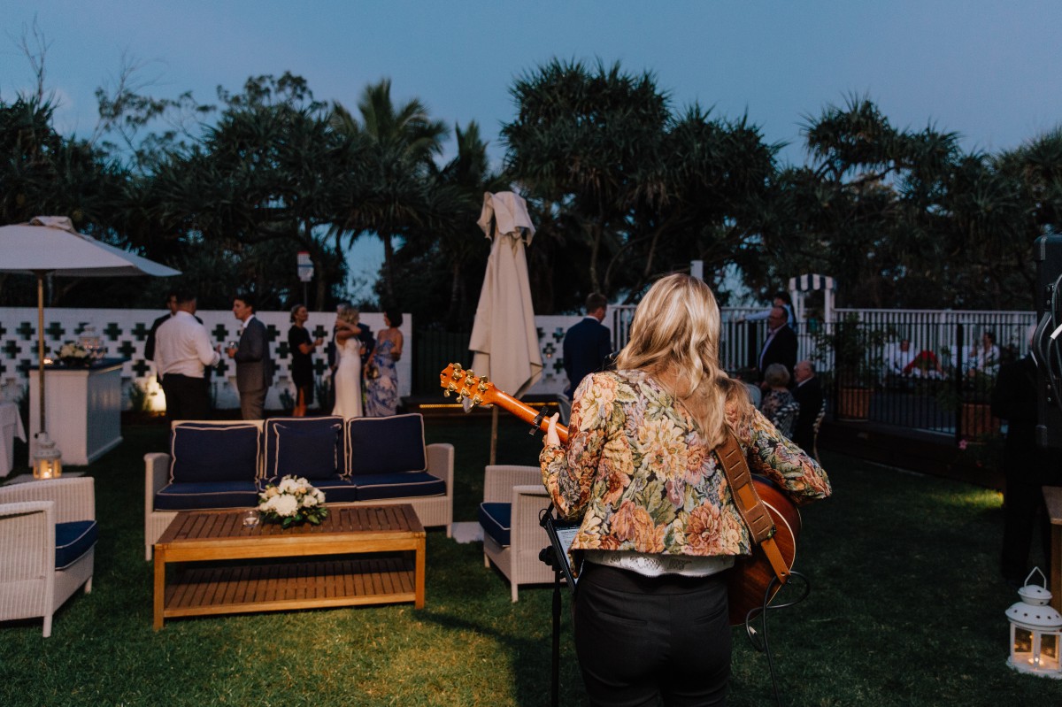Music and guest mingle at wedding reception
