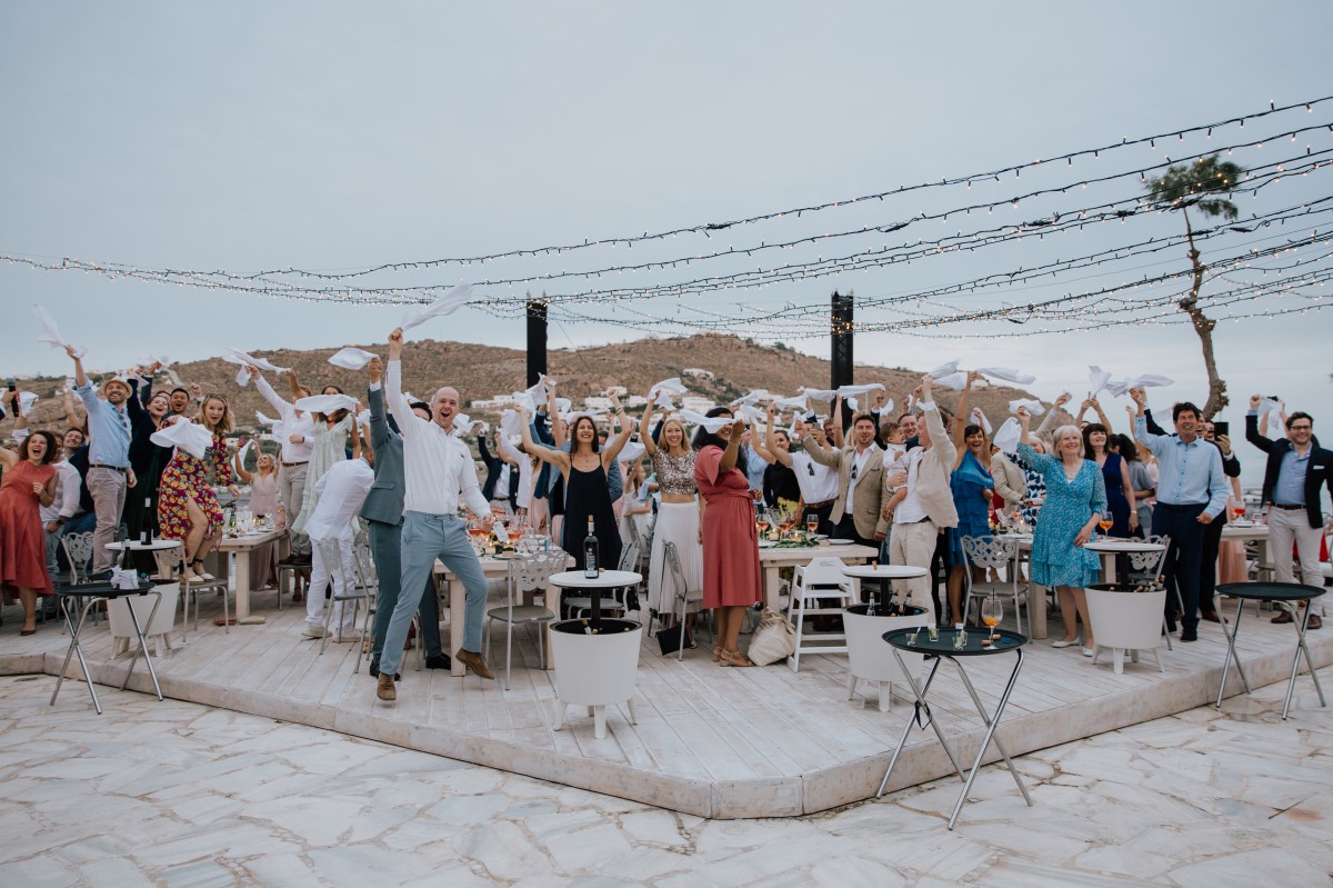 Wedding reception guests celebrate in Mykonos