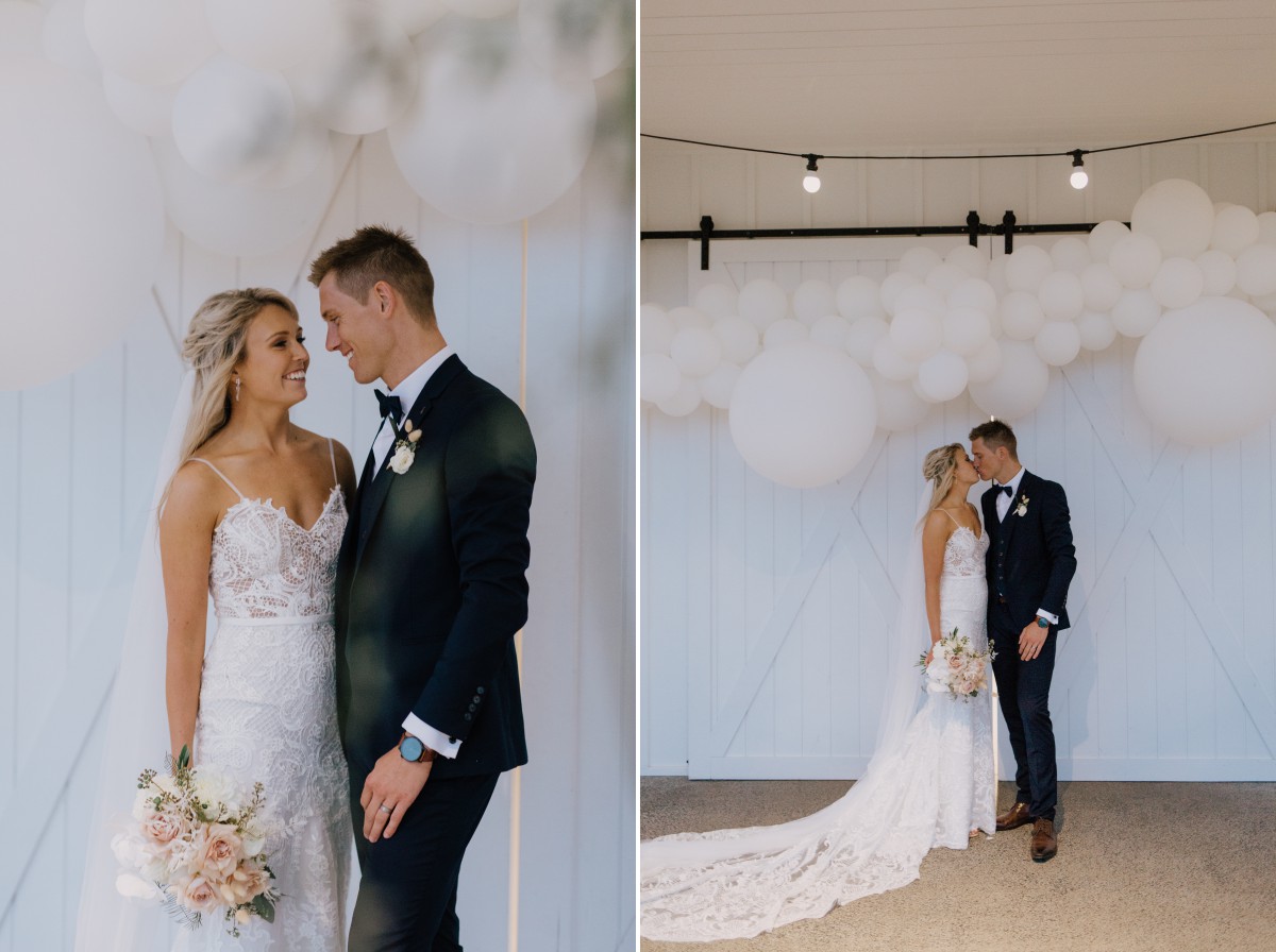 bride and groom with white baloons