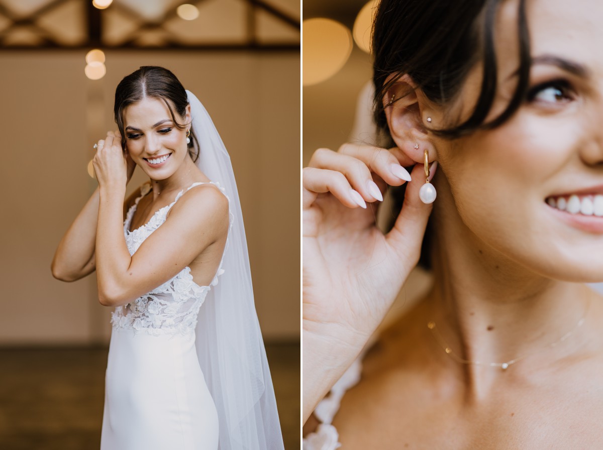 bride putting on earrings