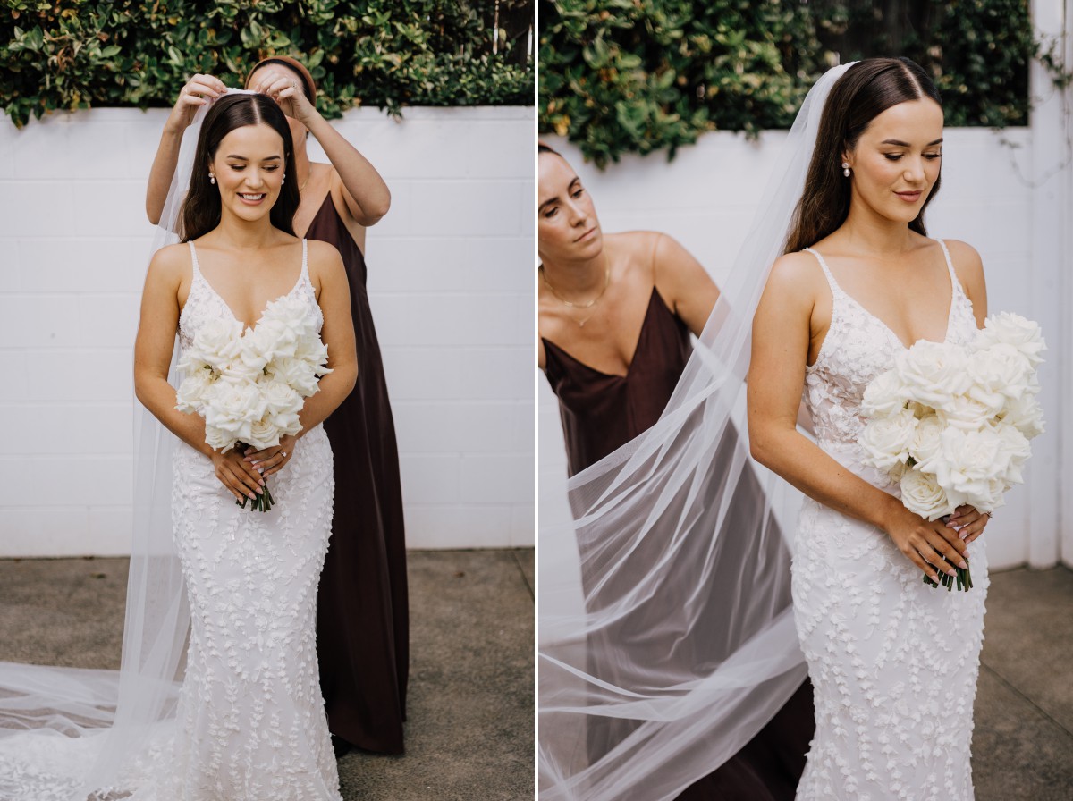 bride getting wedding veil on