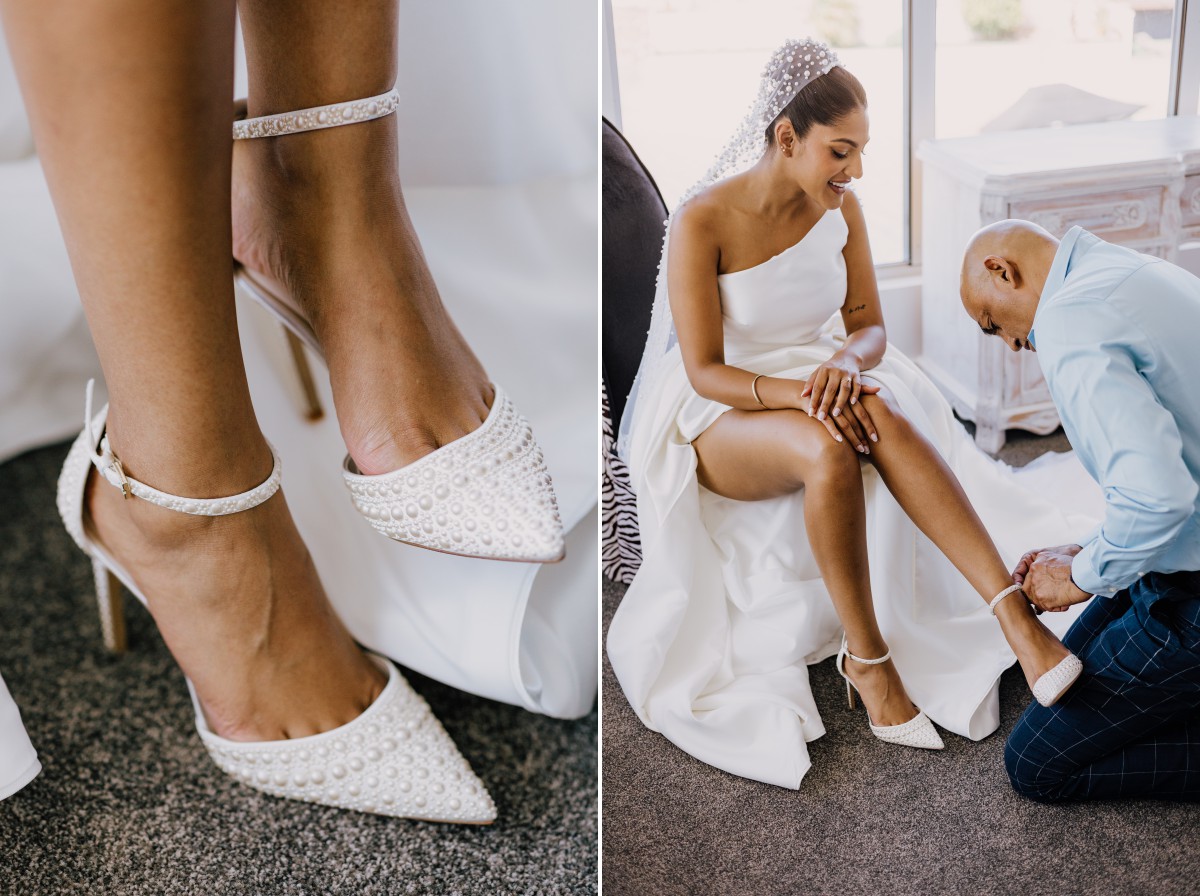 Dad helping his daughter with her wedding shoes