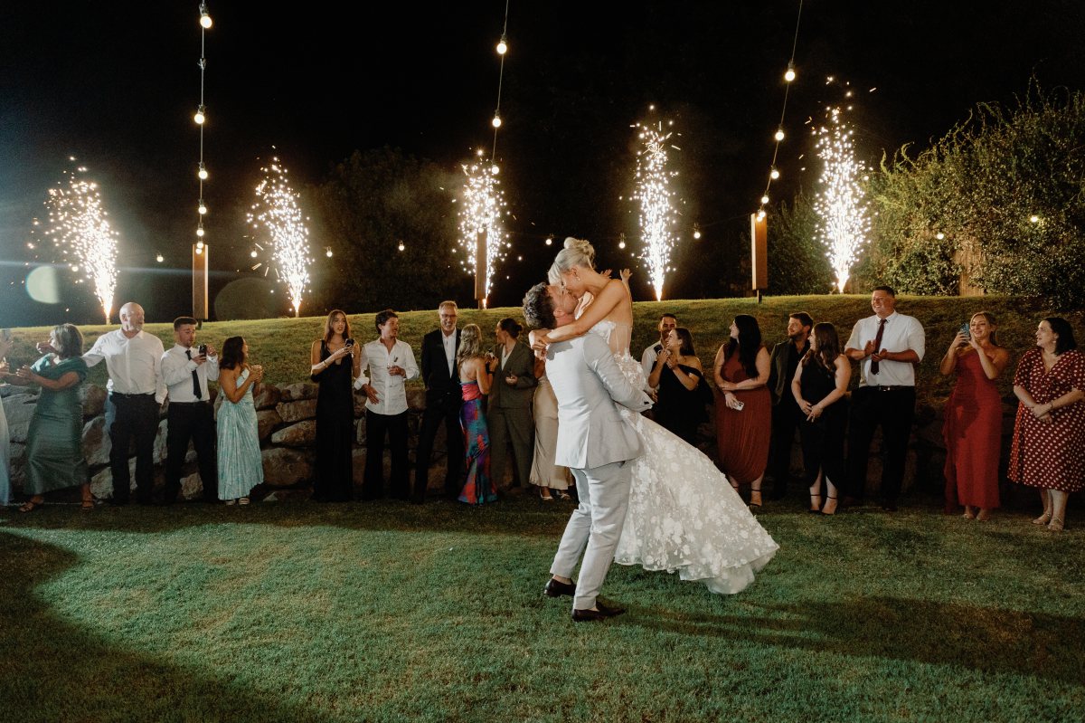 Bride and groom first dance with firworks