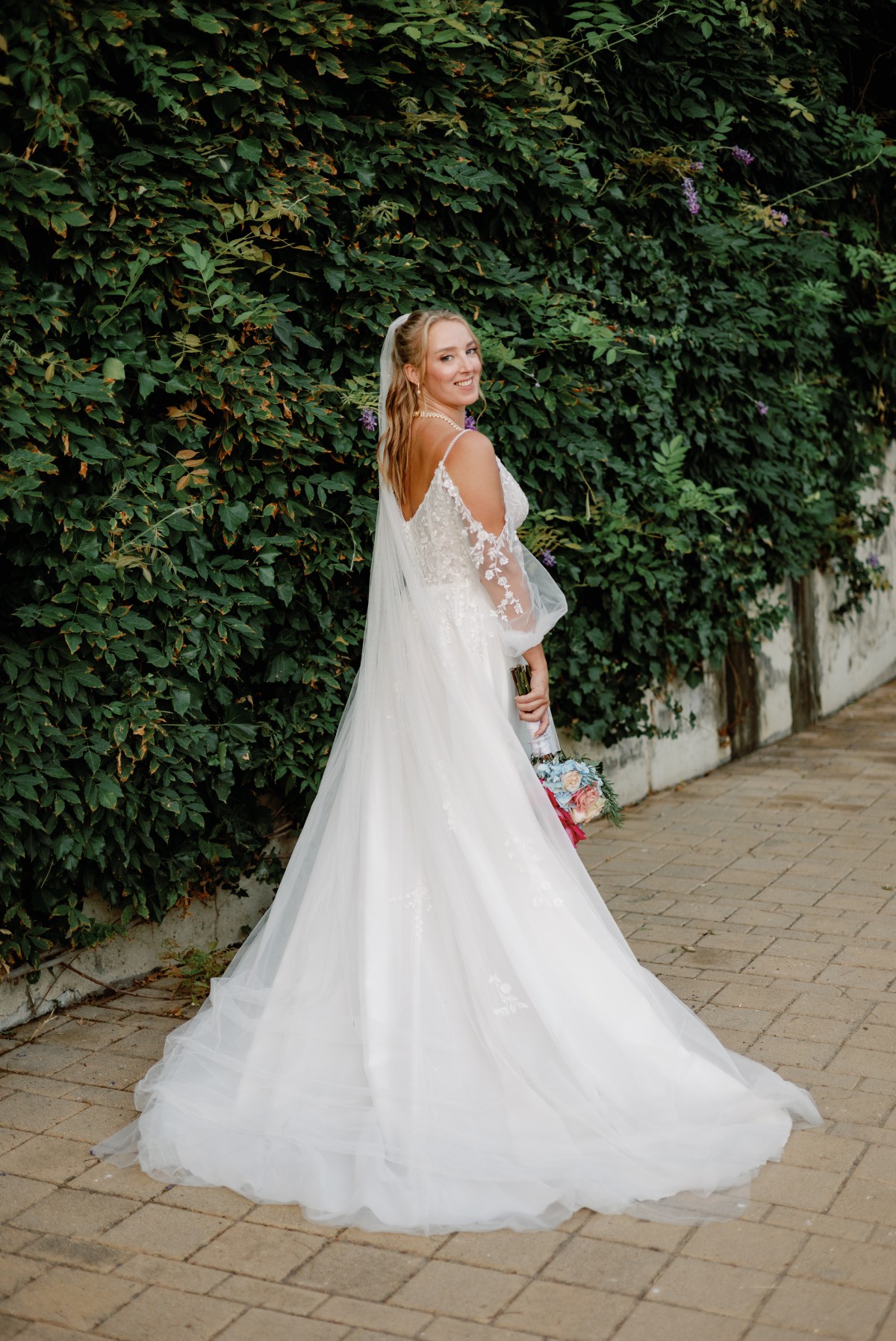 Bride outside Atrium Hotel in Skiathos, Greece on wedding day
