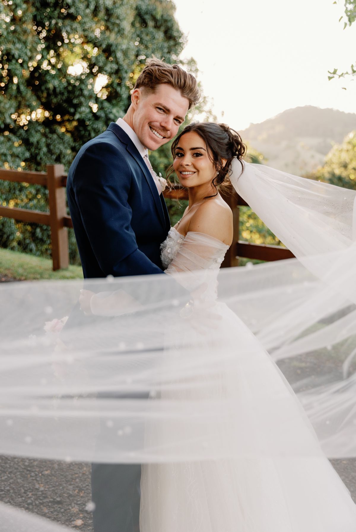 Candid wedding photography shot of brides veil