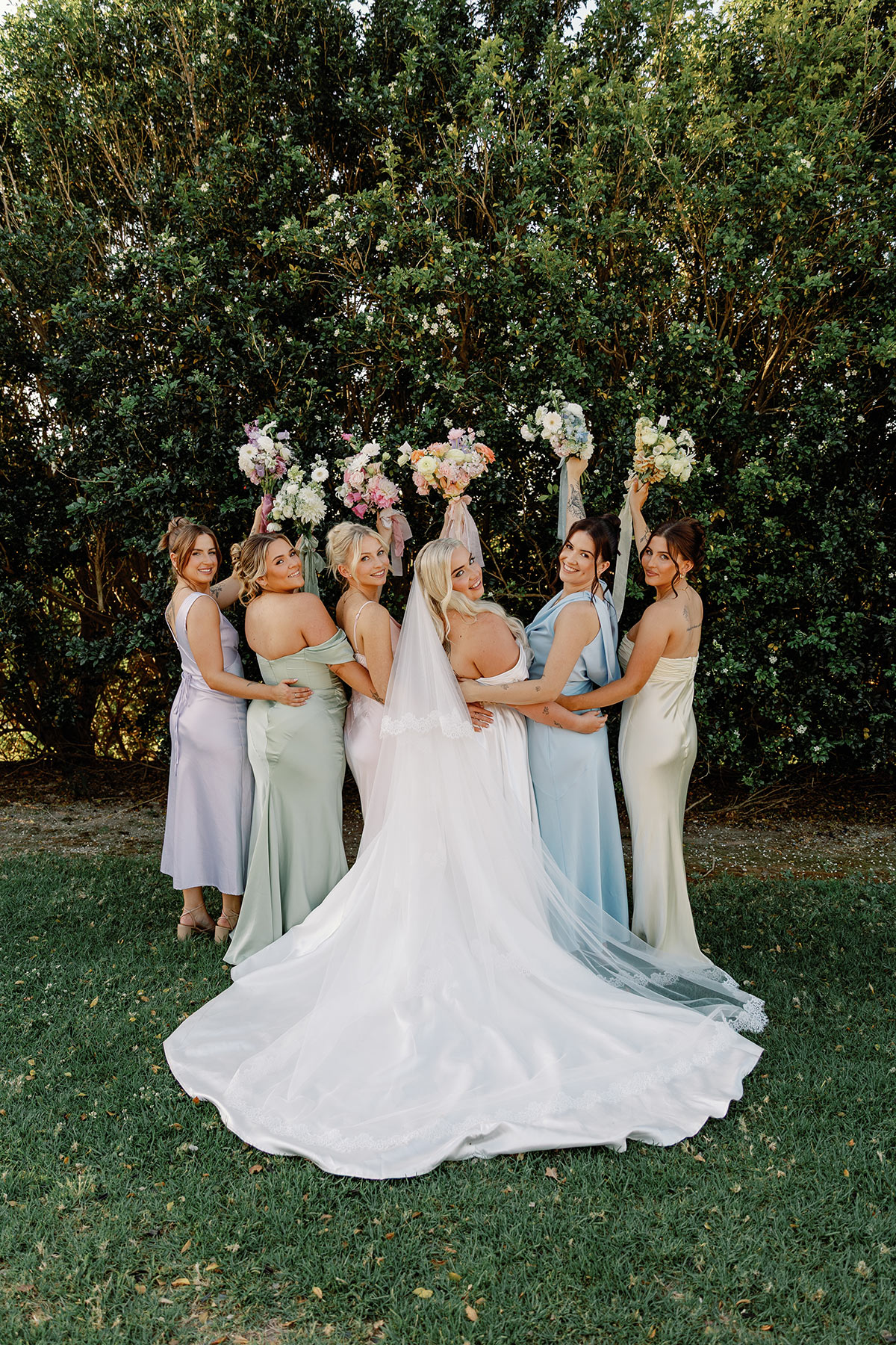 Bride and Bridesmaids in colourful dresses and flowers